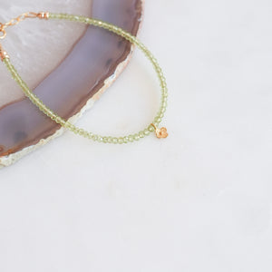 Peridot beaded bracelet with 18k Solid Gold Charm