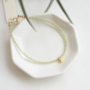 Peridot beaded bracelet with 18k Solid Gold Charm