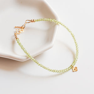 Peridot beaded bracelet with 18k Solid Gold Charm