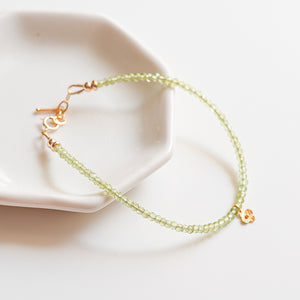 Peridot beaded bracelet with 18k Solid Gold Charm