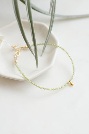 Peridot beaded bracelet with 18k Solid Gold Charm